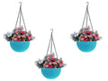 GoHooked light blue plastic hanging planter with woven texture, filled with pink and purple flowers.