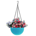 GoHooked light blue plastic hanging pot with woven texture, filled with pink and purple flowers. 7.1 inch diameter.
