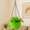 GoHooked light green plastic hanging planter with diamond texture and metal chain, holding a green plant.