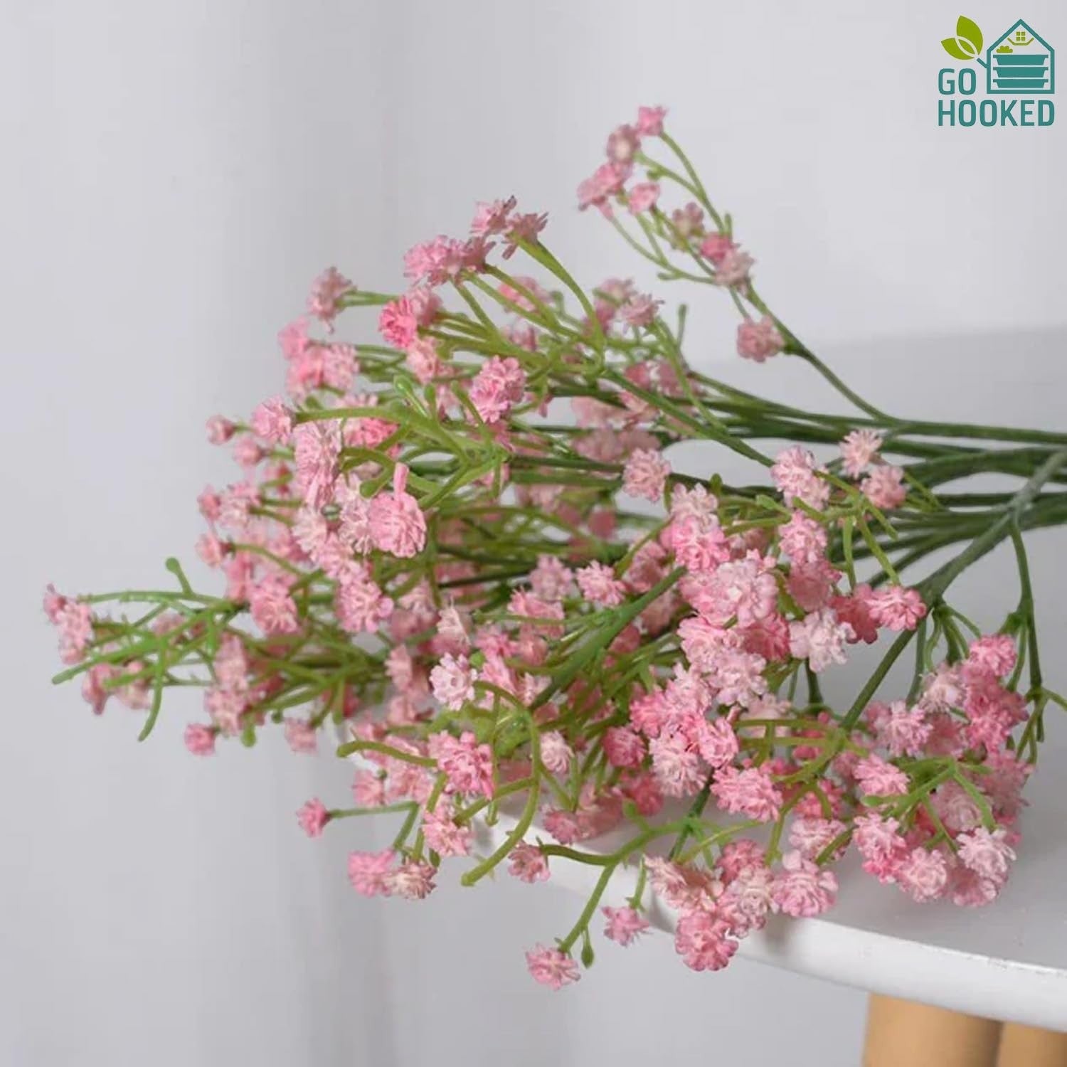 GoHooked light pink artificial baby's breath flowers with flexible stems for wedding bouquets and floral arrangements.