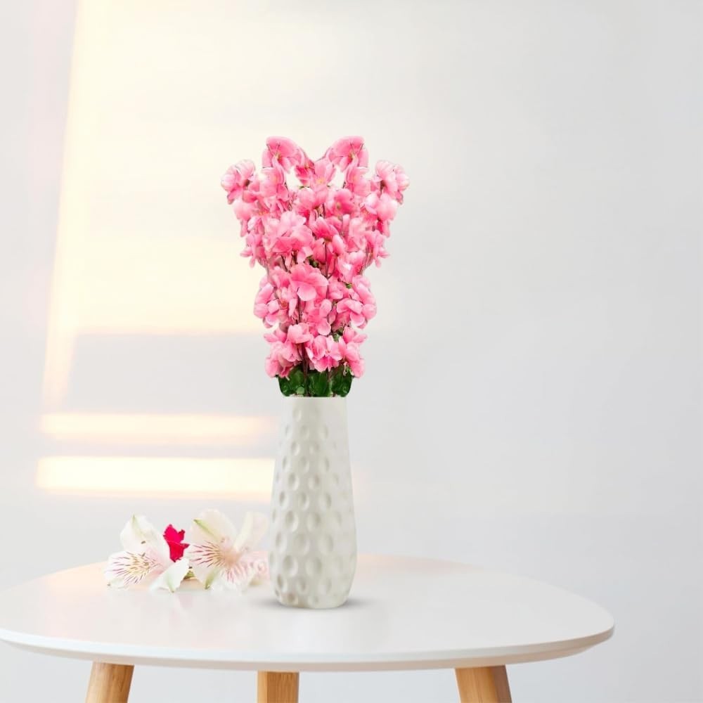 GoHooked light pink artificial flowers in a white textured vase, with two white and pink accent flowers on the side.