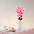 GoHooked light pink artificial flowers in a white textured vase, a decorative accent for home or office.