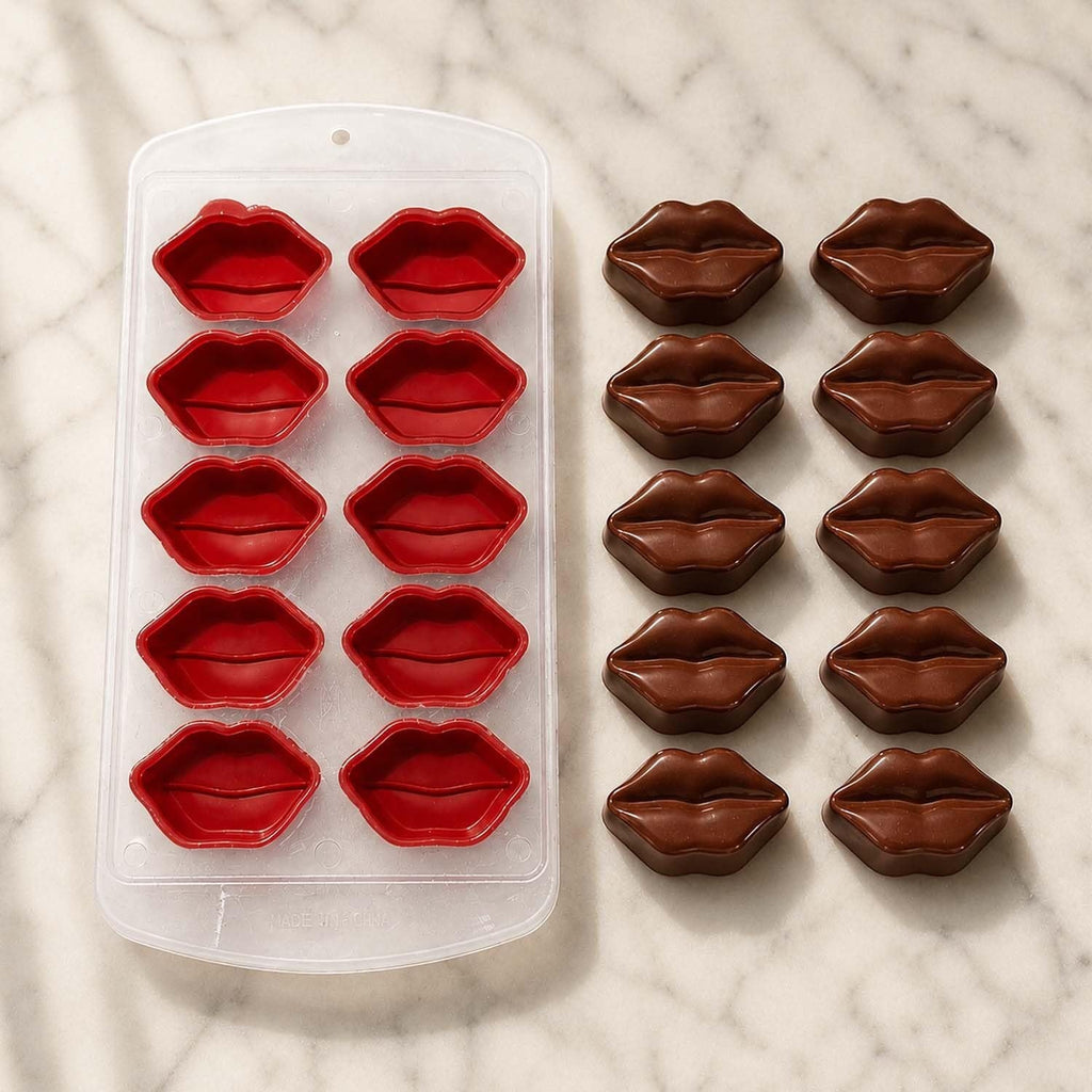 GoHooked 10-cavity red silicone mold for making lip-shaped chocolates and candies on a marble surface