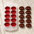 GoHooked 10-cavity red silicone mold for making lip-shaped chocolates and candies on a marble surface