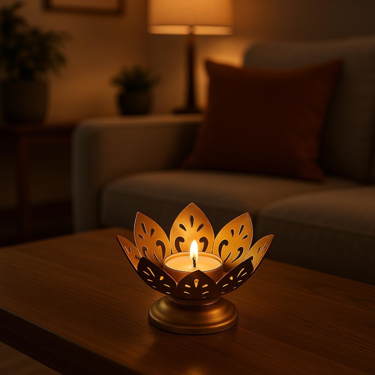 GoHooked matte gold metal lotus tealight holder with a lit candle, perfect for Diwali and home decor.