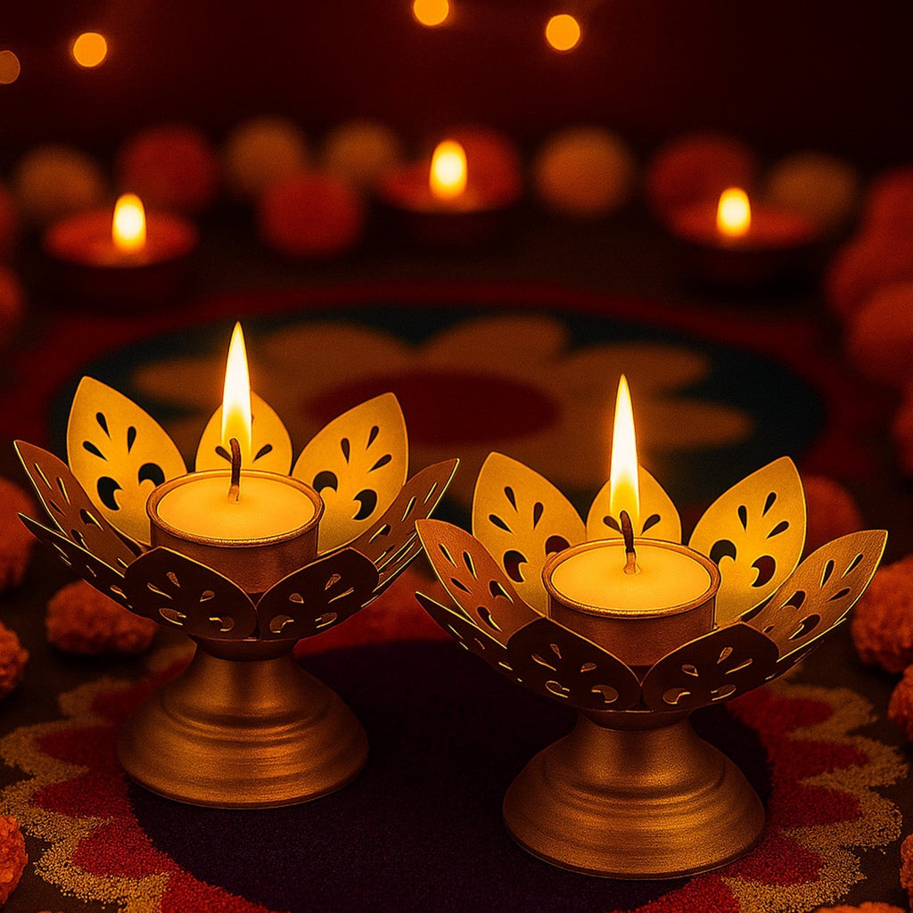GoHooked set of 2 matte-gold metal lotus tealight holders with lit candles, intricate petal design.