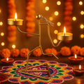 GoHooked matte gold metal figurine tealight holder with two candle cups, set of 1, ideal for Diwali decor.