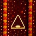 GoHooked matte gold metal hanging triangle tealight candle holder with floral cut design and chain.