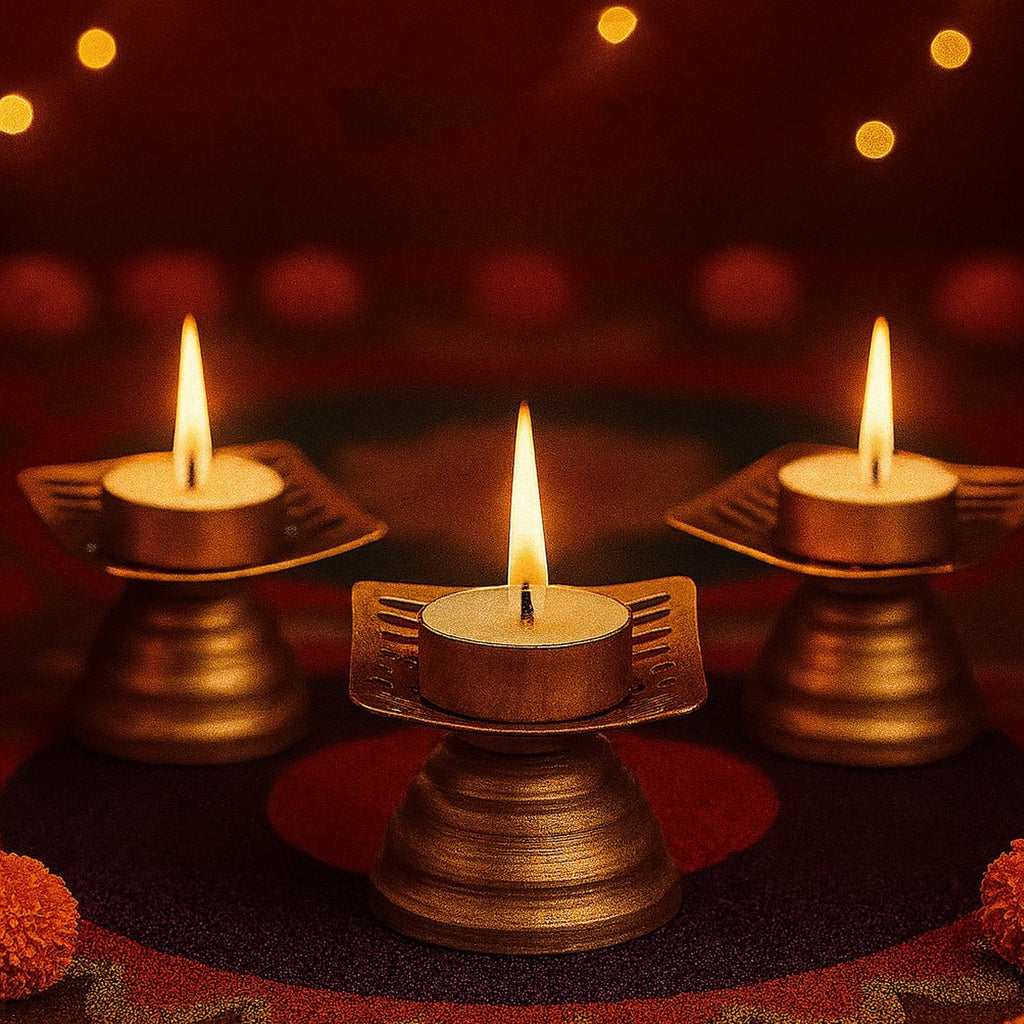 GoHooked set of 3 matte gold metal tealight candle holders with floral cutouts, perfect for Diwali and festive decor.