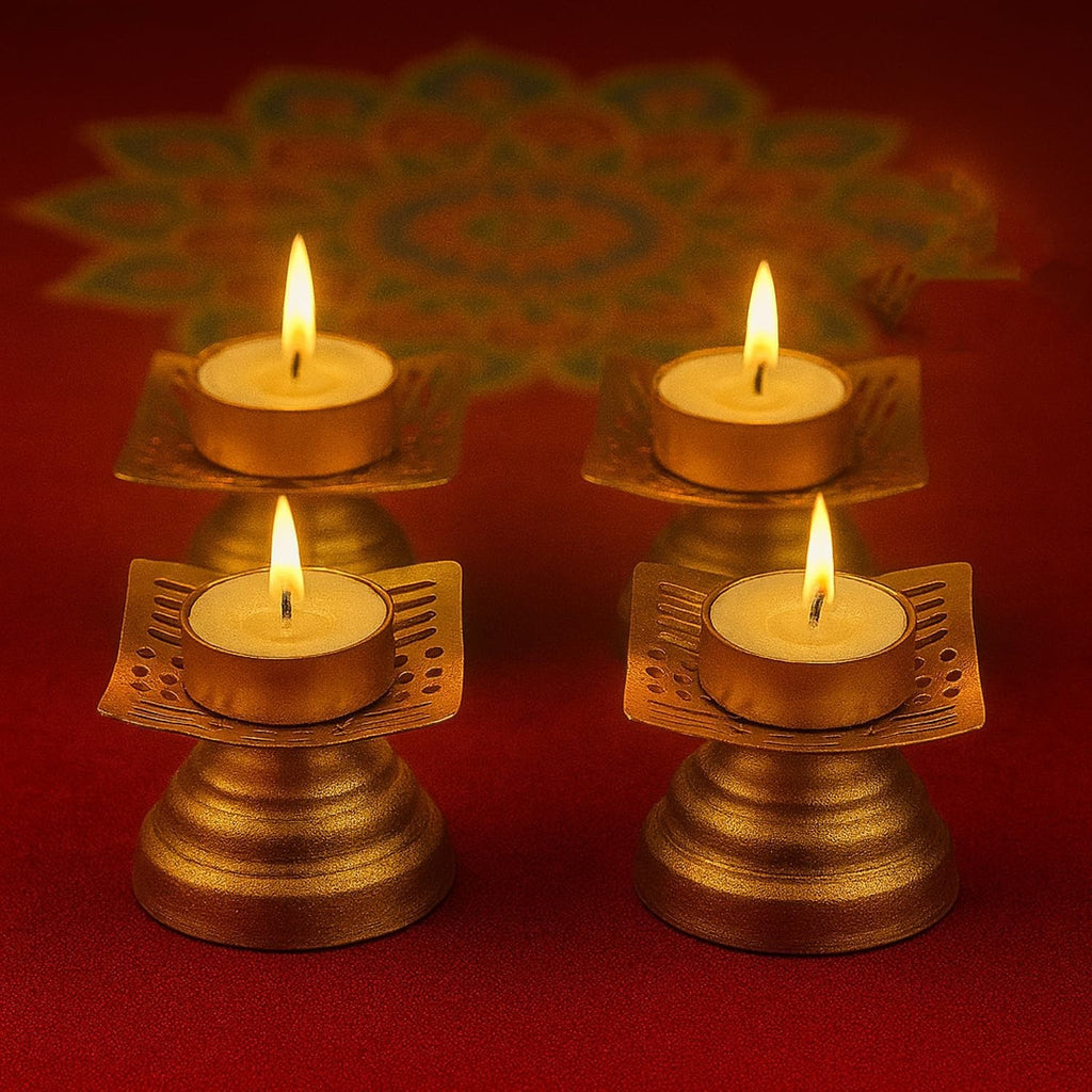 Go Hooked set of 4 matte gold metal tealight candle holders with floral cutouts, perfect for Diwali decor.