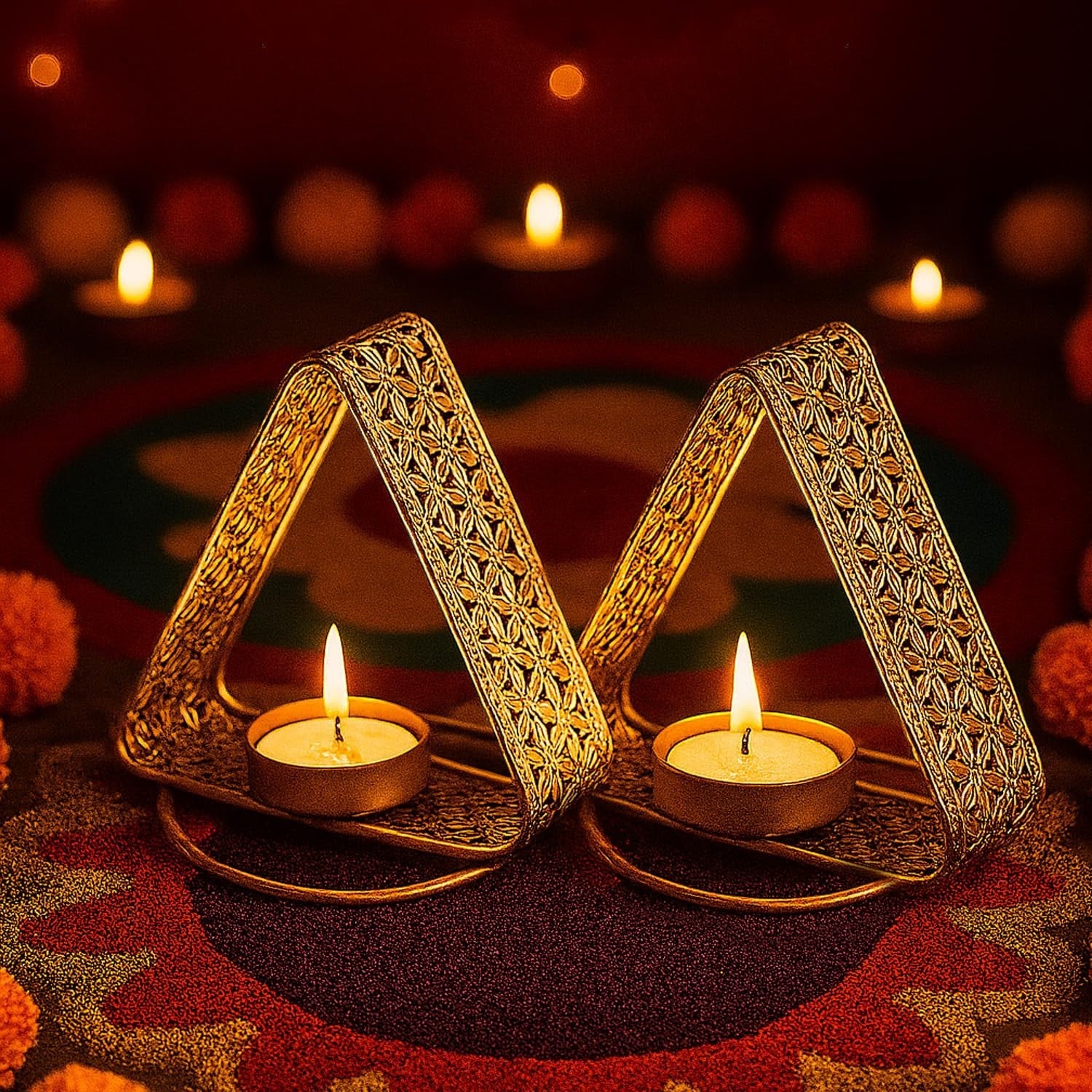 GoHooked matte gold triangular tealight holders with floral cutwork, set of 2, with lit tealights.