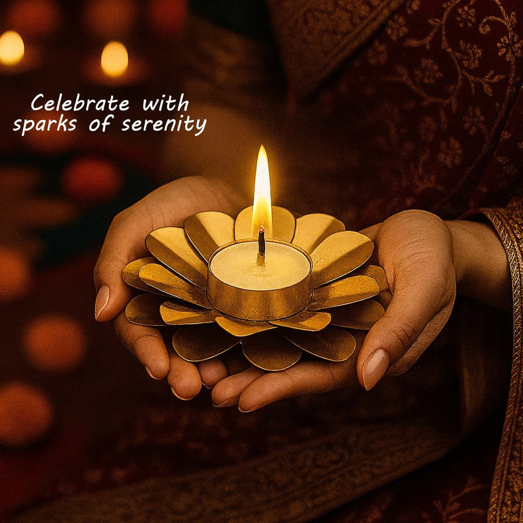 Go Hooked matte gold metal tealight holder in a flower design, held in hands. Festive décor.