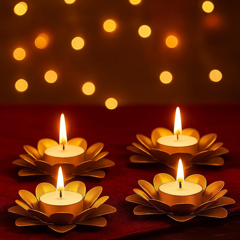 GoHooked set of 4 matte gold metal flower tealight holders with lit candles. Ideal for Diwali.