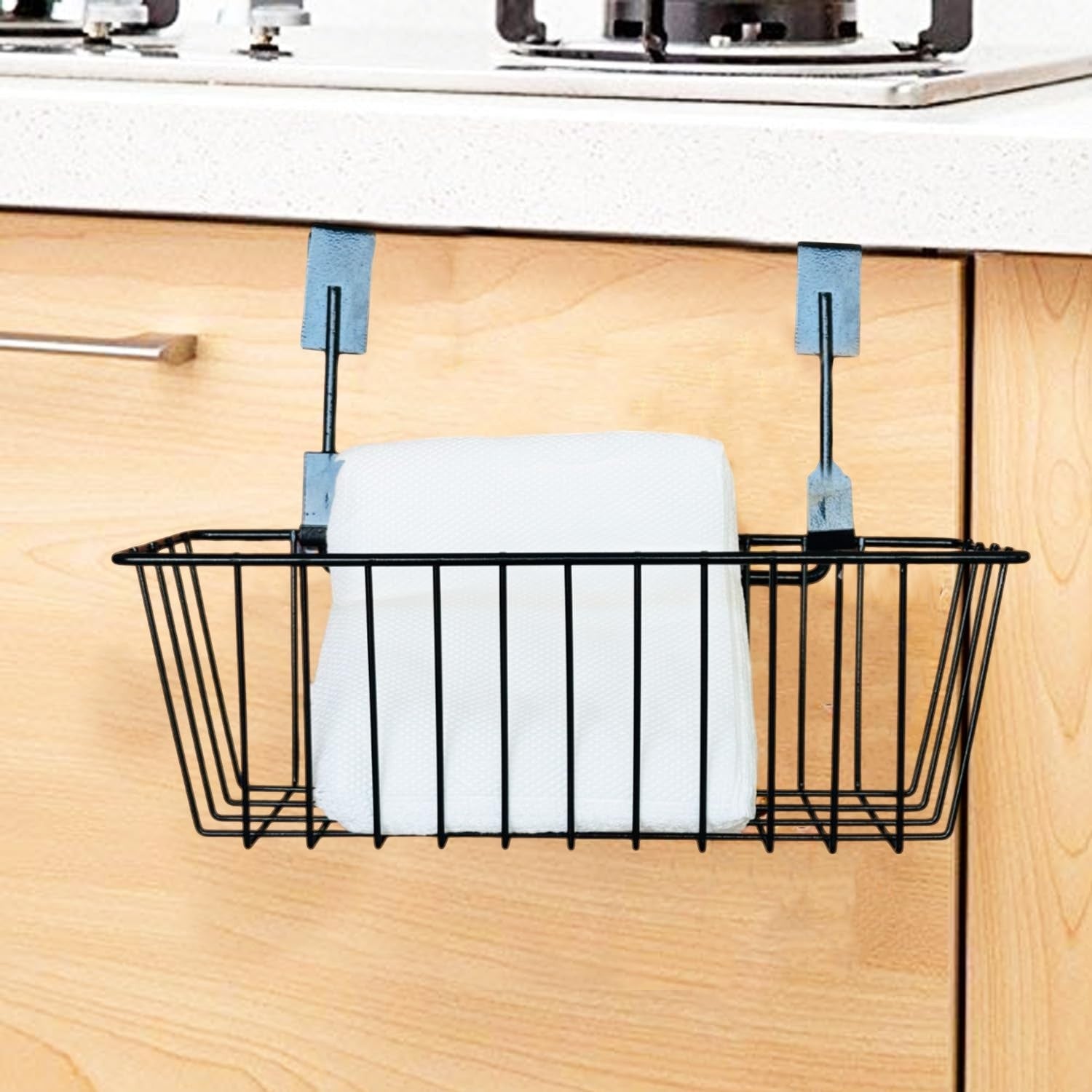 GoHooked black metal hanging storage basket with white paper towels, slides over cabinet door.