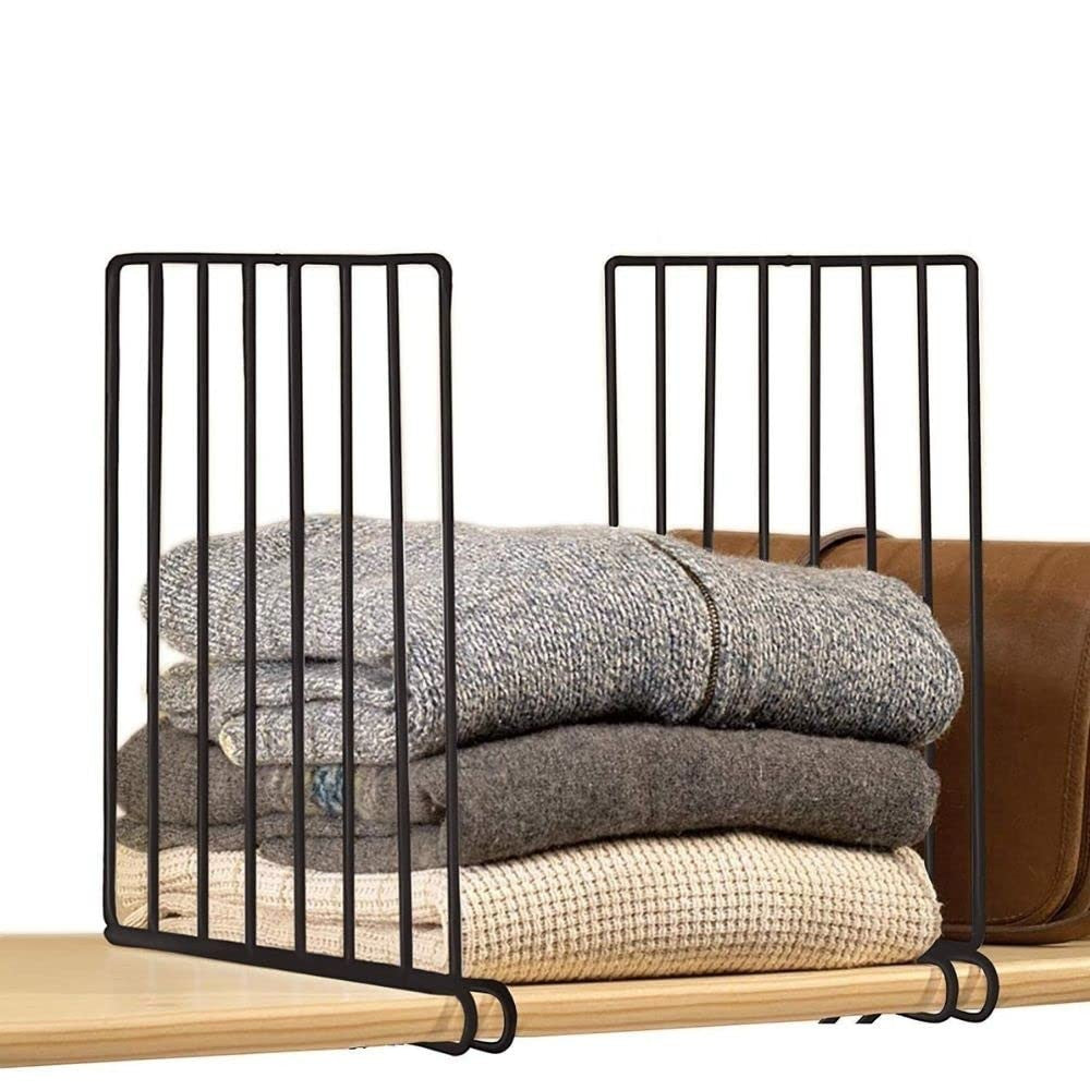 GoHooked black metal shelf dividers organizing folded sweaters and a brown bag on a wooden shelf.