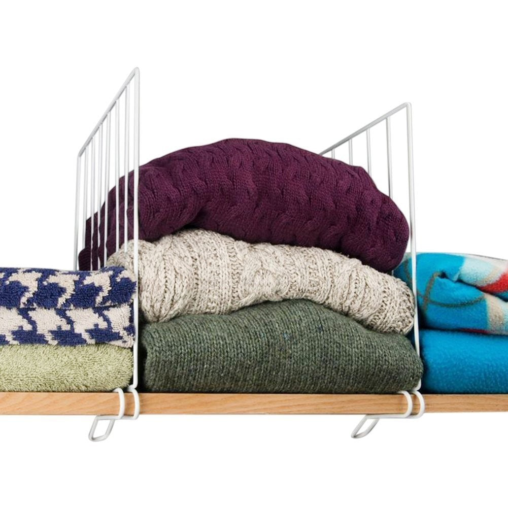 GoHooked white metal wire shelf dividers organizing stacks of sweaters, towels, and blankets on a wooden shelf.