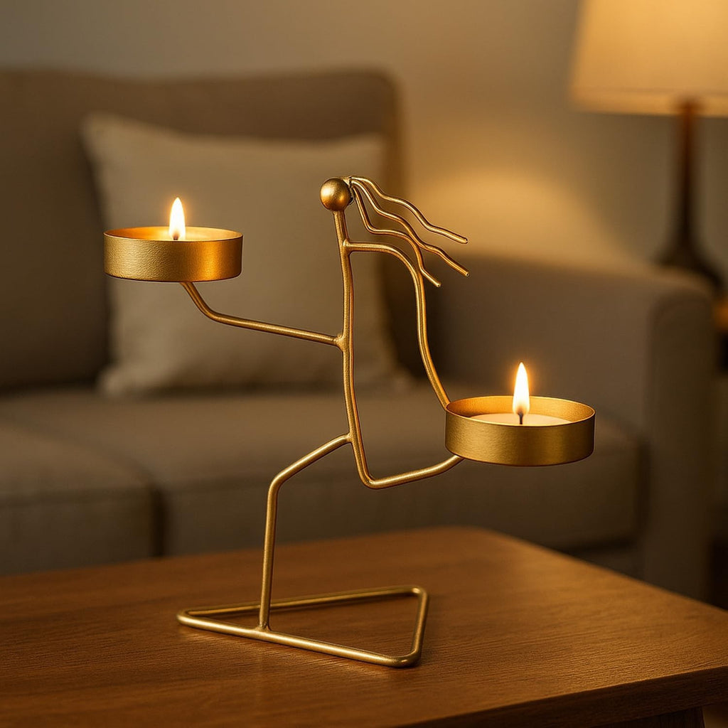 Go Hooked matte gold metal tealight candle holder with dual tray in a figurine design, 14cm tall.