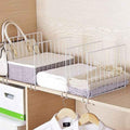 GoHooked white metal wardrobe shelf dividers organizing folded clothes, towels, and a handbag.