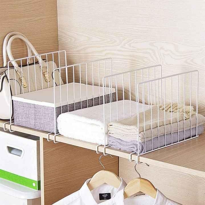 GoHooked white metal wardrobe shelf dividers organizing folded clothes, towels, and a handbag.