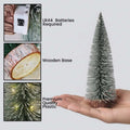 GoHooked green mini Christmas tree with LED lights and a wooden-style base, 7 inches tall.