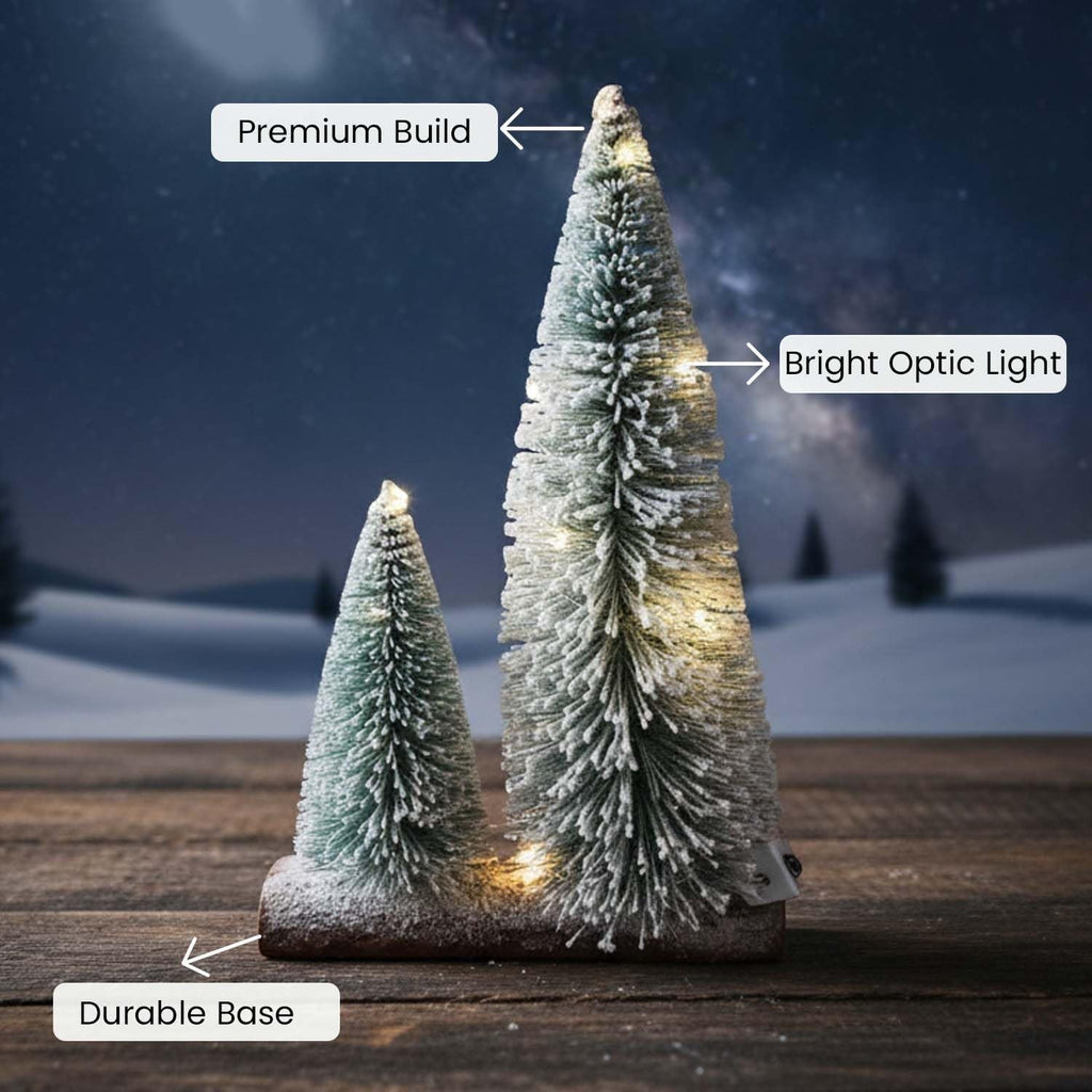 GoHooked snow-flocked mini Christmas trees with warm LED lights on a wooden base, perfect for tabletop decor.