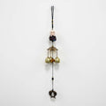 GoHooked brown metal Feng Shui monk figurine wind chime with 3 brass bells and fish charm for positive energy.