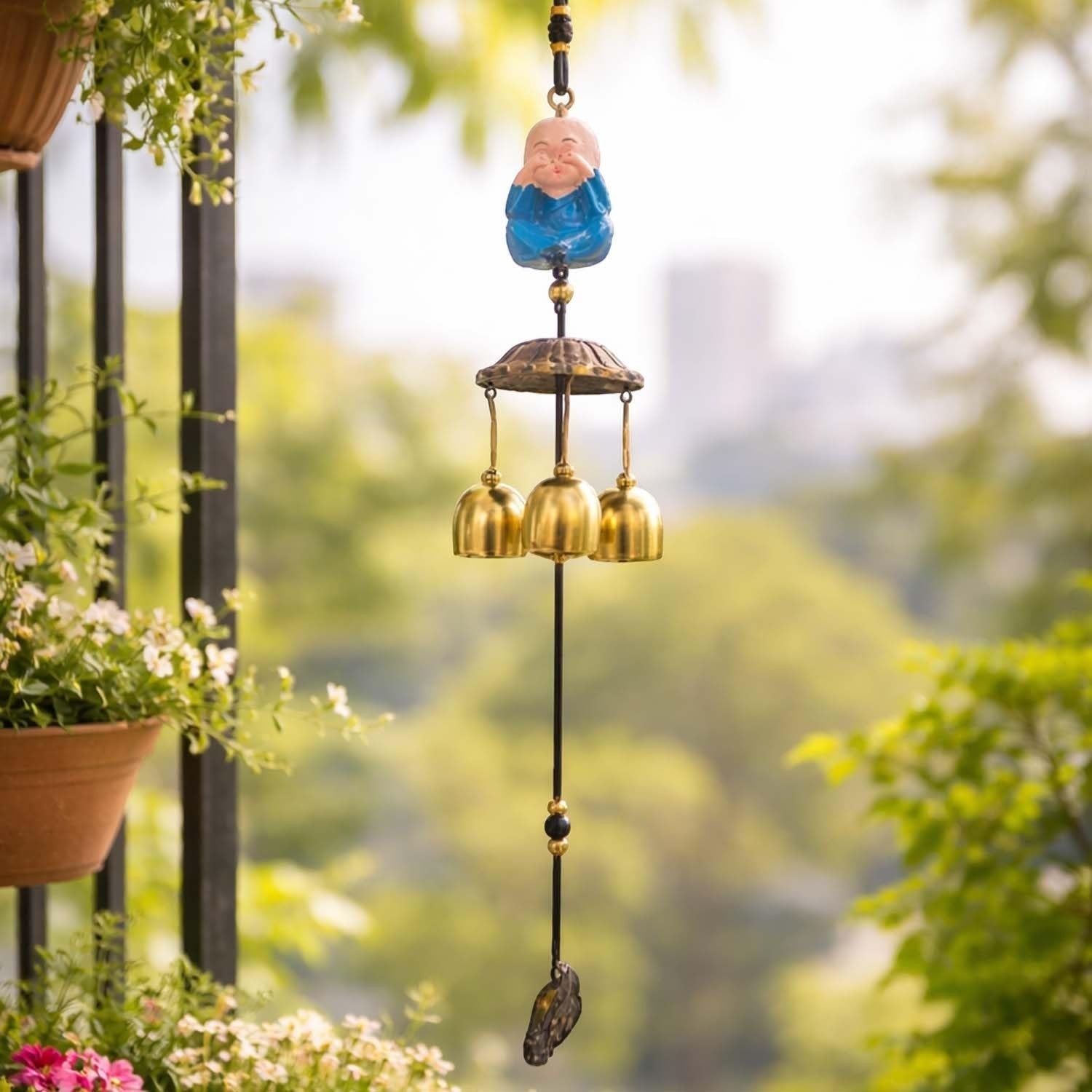 Go Hooked light blue monk figurine wind chime with 3 brass bells, metal, for positive energy and home decor.