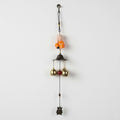 GoHooked orange monk figurine wind chime with brass bells, metal, for positive energy and home decor.