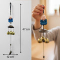 Go Hooked light blue monk figurine wind chime with 3 brass bells, 47cm long, for positive energy and home decor.