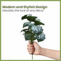 GoHooked Monstera Dubia artificial plant with 18 green leaves and silver patterns, held in a hand.