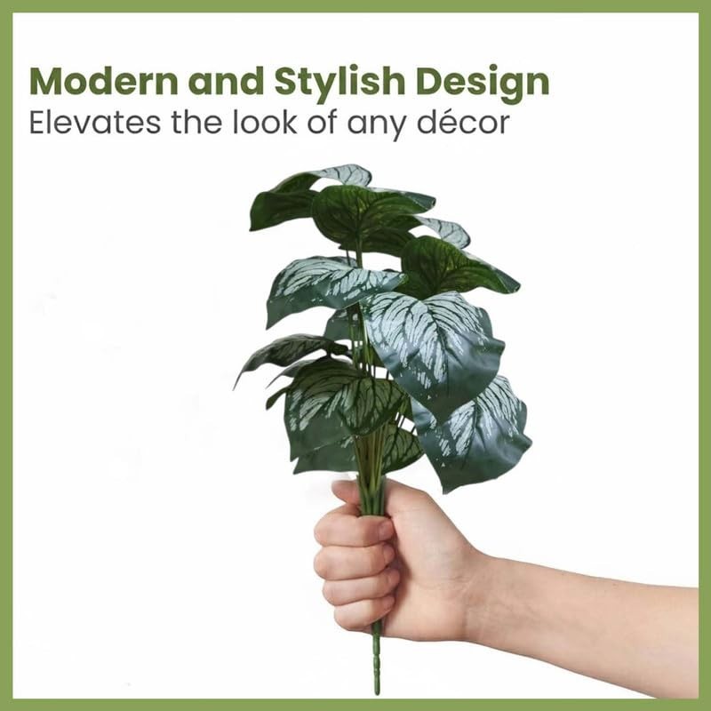 GoHooked Monstera Dubia artificial plant with 18 green leaves and silver patterns, held in a hand.