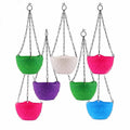 GoHooked set of 7 multicolored plastic hanging planters with chains. Diamond pattern, round shape, 7.5 x 5.5 inches.
