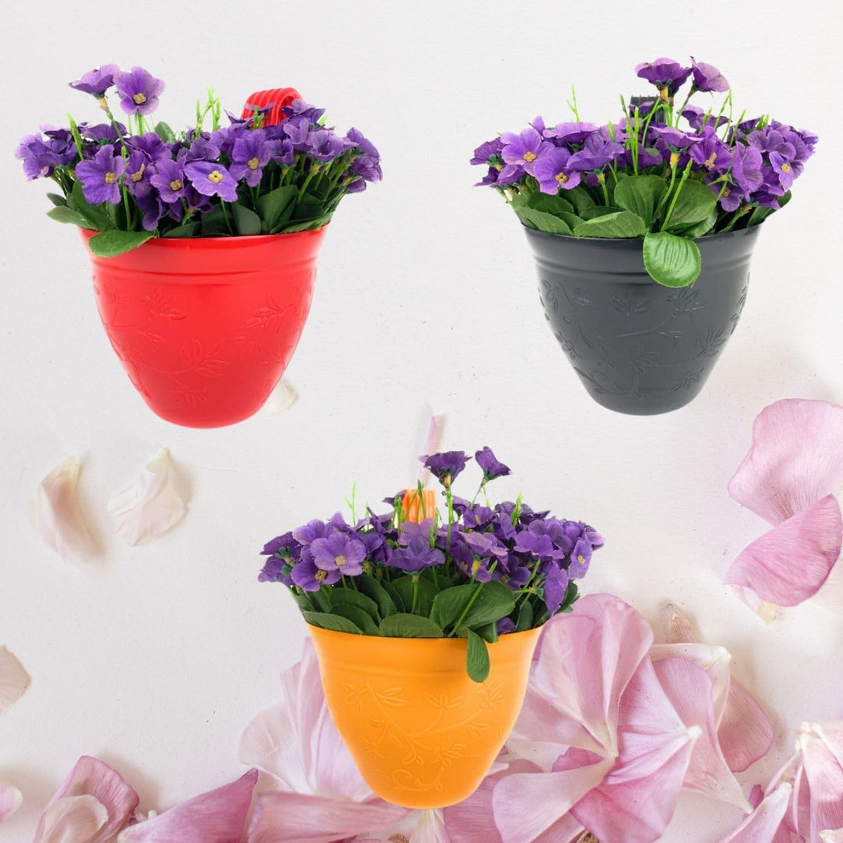 GoHooked set of 3 multicolor plastic hanging planters with purple flowers, ideal for balcony gardening.