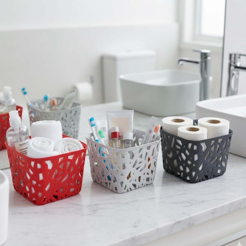 Go Hooked multicolor plastic storage baskets with geometric cutouts, holding toiletries and towels on a bathroom counter.