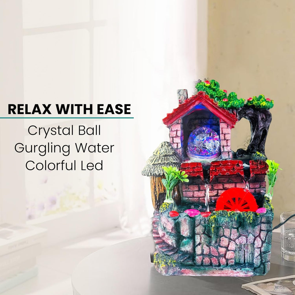 Go Hooked multicolor polyresin tabletop waterfall fountain with crystal ball and colorful LED lights.