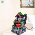 Go Hooked multicolor polyresin tabletop waterfall fountain with LED lights and adjustable speed control.