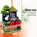 Go Hooked multicolor polyresin tabletop waterfall fountain with LED lights and red water wheel.