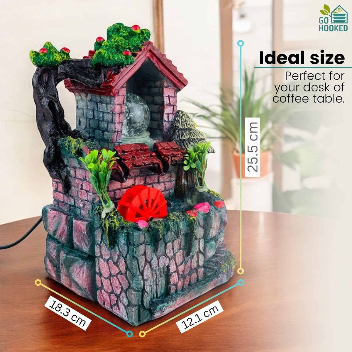 Go Hooked multicolour polyresin tabletop waterfall fountain with LED lights and adjustable speed control.