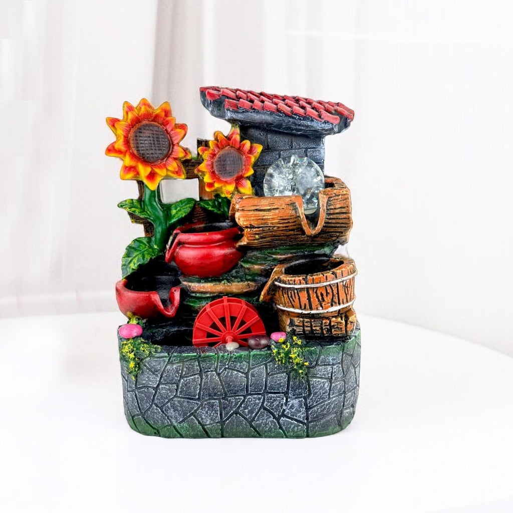 GoHooked multicolour polyresin tabletop waterfall fountain with sunflowers, red pots, and LED lights.