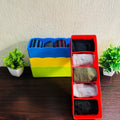 GoHooked set of 4 multicoloured plastic drawer organisers filled with socks and underwear. Space-saving and durable.