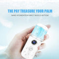 GoHooked white USB nano mist facial sprayer with blue water reservoir, held in hand.