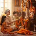 GoHooked orange artificial marigold flower garlands decorating a home altar with a grandmother and two children.