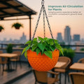 GoHooked orange plastic hanging planter with woven texture and metal chain, 8.5 inch diameter.