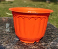 GoHooked orange plastic Jasmine planter pot with scalloped rim and fluted sides, 20.5x15 cm.