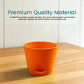 GoHooked orange plastic planter pot with self-watering reservoir, perfect for indoor or outdoor use.