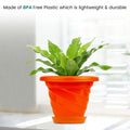 GoHooked orange plastic planter pot with saucer, modern twister design, 6 inch size, ideal for indoor/outdoor plants.