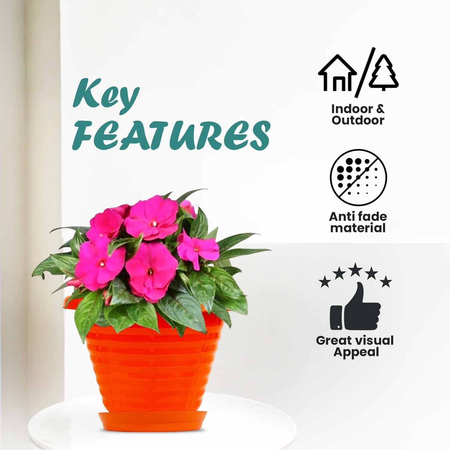 GoHooked orange plastic planter pot with saucer, featuring pink flowers. Suitable for indoor/outdoor use.