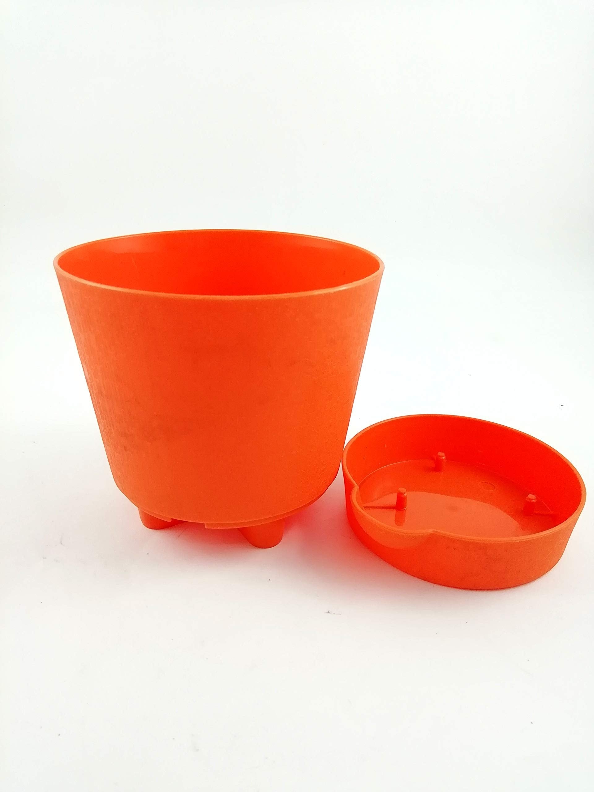GoHooked orange plastic planter with drainage saucer, perfect for indoor or outdoor use.
