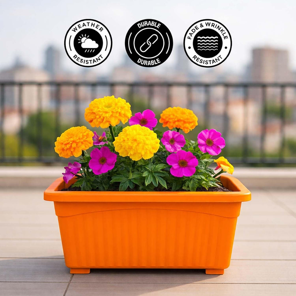 Go Hooked orange rectangular plastic plant pot with yellow and pink flowers. Weather, fade & wrinkle resistant.