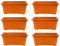 Go Hooked set of 6 orange rectangular plastic plant pots with ribbed texture and raised feet.